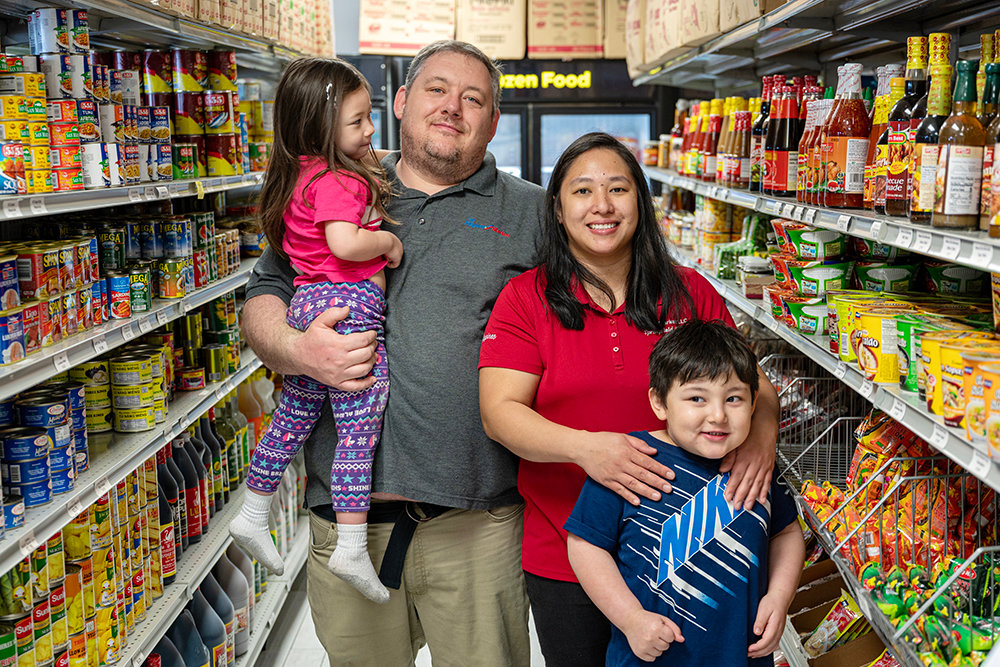 Filipino Market owners Joey and Mary Kris Palmer, with children Noah, 5, and Sophia, 3, say they try to put community over profit.